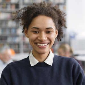 close-up-smiley-woman-library