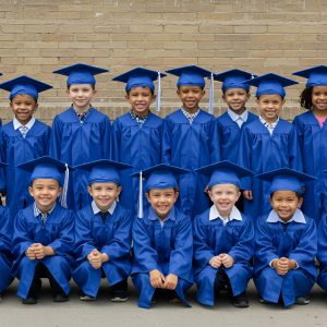 group-children-blue-graduation-gowns-caps